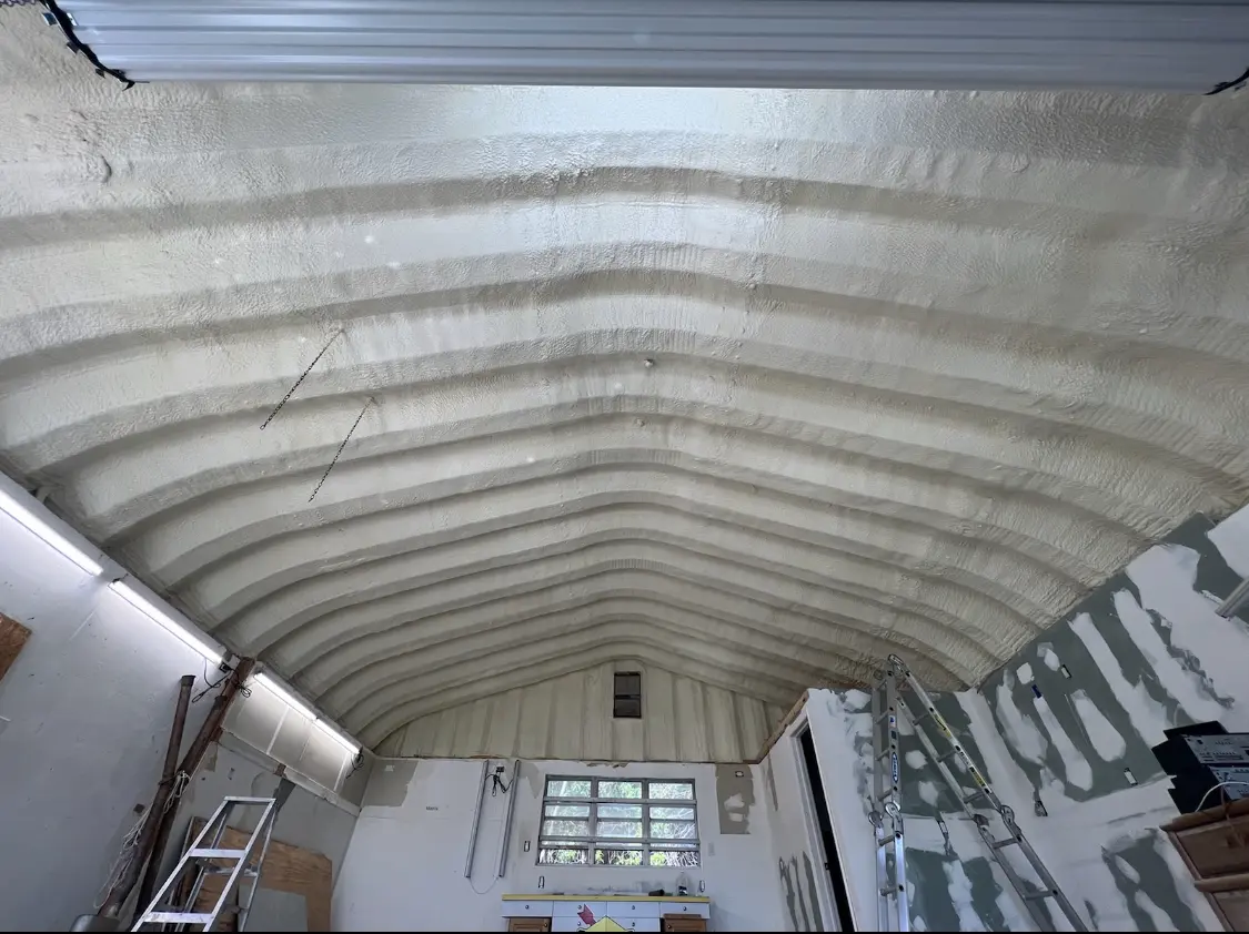 Spray polyurethane foam applied to the underside of a metal roof deck in Rapid Valley
